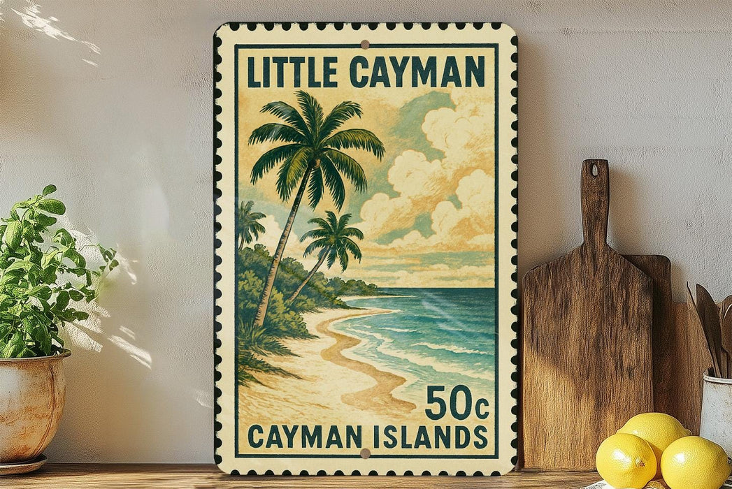 A framed vintage postage stamp depicting a tropical beach scene with palm trees and a sandy shoreline, placed on a shelf next to a wooden cutting board and a potted plant.