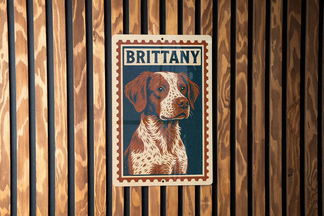 A metal sign with a picture of a dog, specifically a brittany dog, is displayed on a wooden wall.