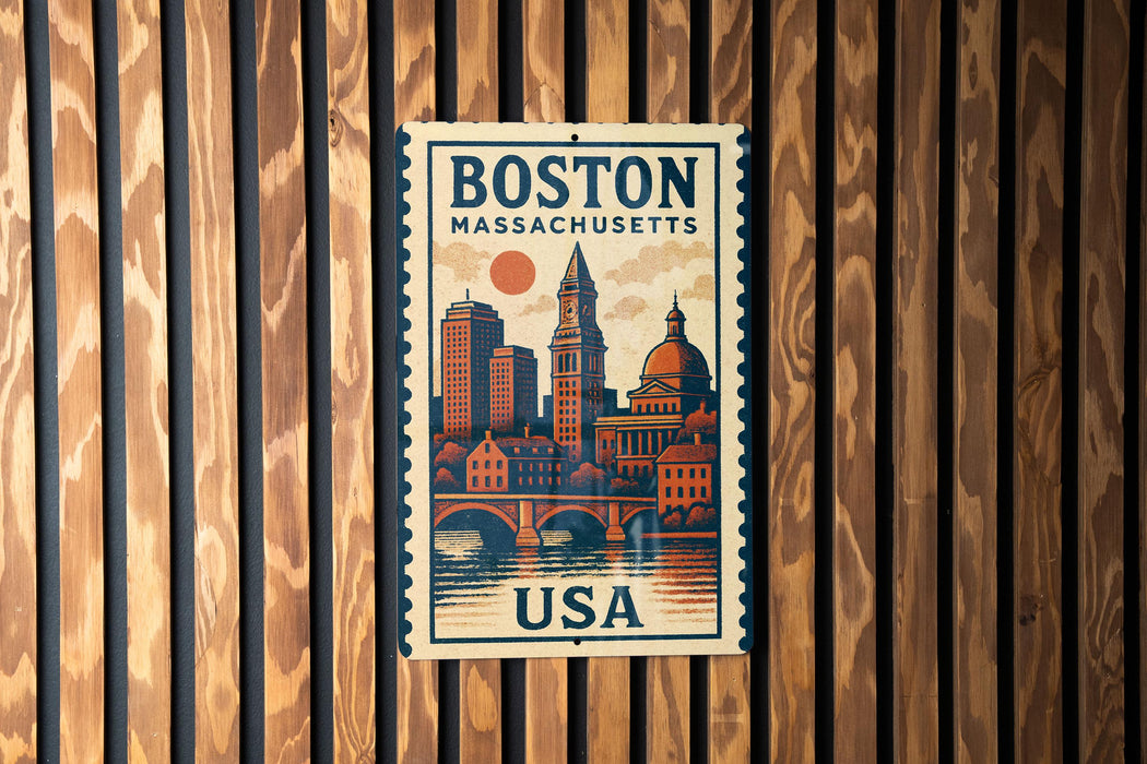 A vintage-style poster of Boston, Massachusetts, featuring a cityscape with buildings, a clock tower, and a bridge, is displayed on a wooden wall.