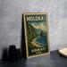 A vintage-style metal stamp depicting a scenic coastal landscape with mountains, water, and the text "MOLOKAI, HAWAII, USA" is displayed on a gray wall.