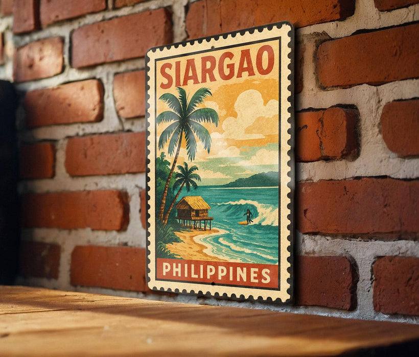 A vintage-style poster of Sargao, a tropical island in the Philippines, is displayed on a brick wall.