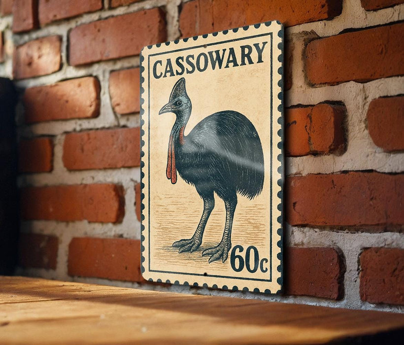 A vintage-style postage stamp featuring a large illustration of a black bird, likely a cassowary, mounted on a brick wall.