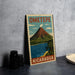 A vintage-style poster of Ometepe, the largest active volcano in Central America, with a mountain and a body of water in the background.