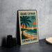 A vintage-style postage stamp from the Grand Cayman Islands, featuring a palm tree and a sailboat on the beach, with the text "GRAND CAYMAN" and "10c" printed on it.