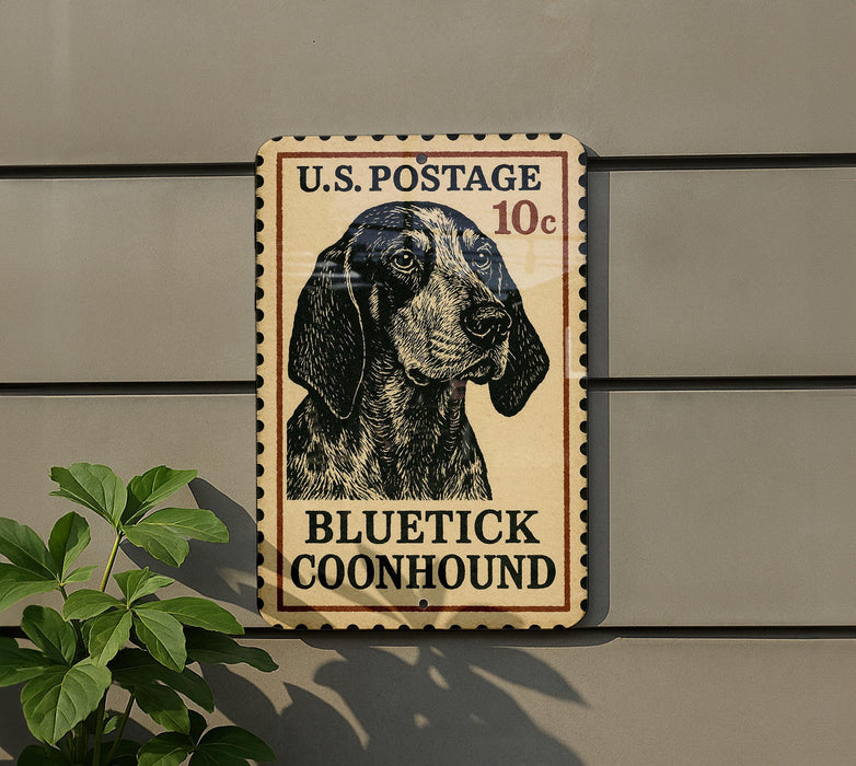 A U.S. postage stamp featuring a blue and black dog, with the text "BLUE TICK COONHOUND" printed on it.