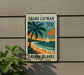 A vintage-style postage stamp depicting a tropical beach scene with a palm tree, a sailboat, and the text "GRAND CAYMAN 10c" and "CAYMAN ISLANDS".