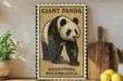 A framed illustration of a panda bear is displayed on a shelf, accompanied by a wooden cutting board, a potted plant, and some lemons.