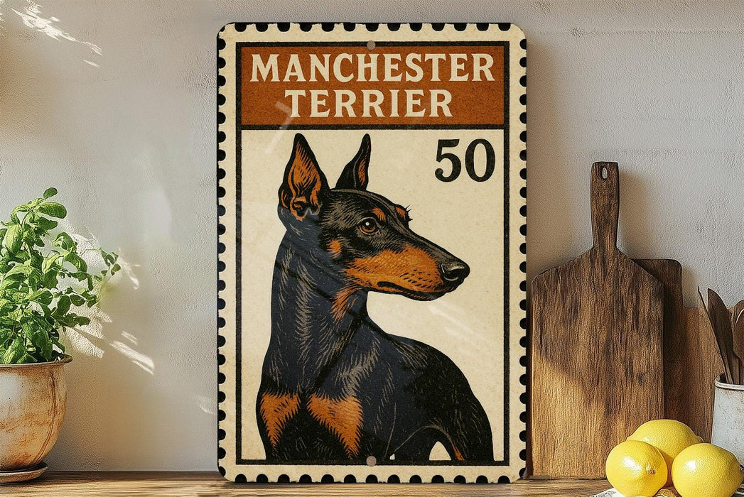 a framed poster of a Manchester Terrier dog, with the text "MANCHESTER TERRIER" and the number "50" printed on it. The poster is displayed on a shelf next to a wooden cutting board and a potted plant.