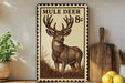 a decorative metal sign with a mule deer illustration, placed on a wooden surface next to a wooden cutting board and some lemons.