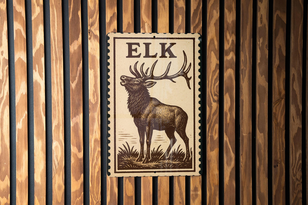 A wooden wall with a framed image of a deer, which appears to be a postage stamp or a decorative piece.