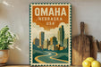 a vintage-style metal sign that reads "OMAHA NEBRASKA USA" with a cityscape illustration. The sign is displayed on a shelf next to a wooden cutting board and a potted plant.
