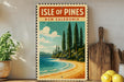 A vintage-style poster of the Isle of Pines in New Caledonia, featuring a beach, pine trees, and a blue sky with clouds.
