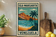 A vintage-style sign for "Isla Margarita" in Venezuela, featuring a tropical beach scene with palm trees and mountains.