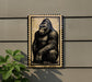a large, detailed illustration of a gorilla sitting on its hind legs, mounted on a wall.