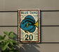 a sign with a blue fish and the number 20 on it, mounted on a wall.
