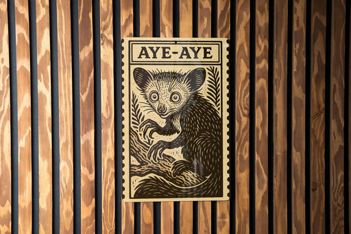 a wooden wall with a framed illustration of a cat, which appears to be a type of longhorn cat.