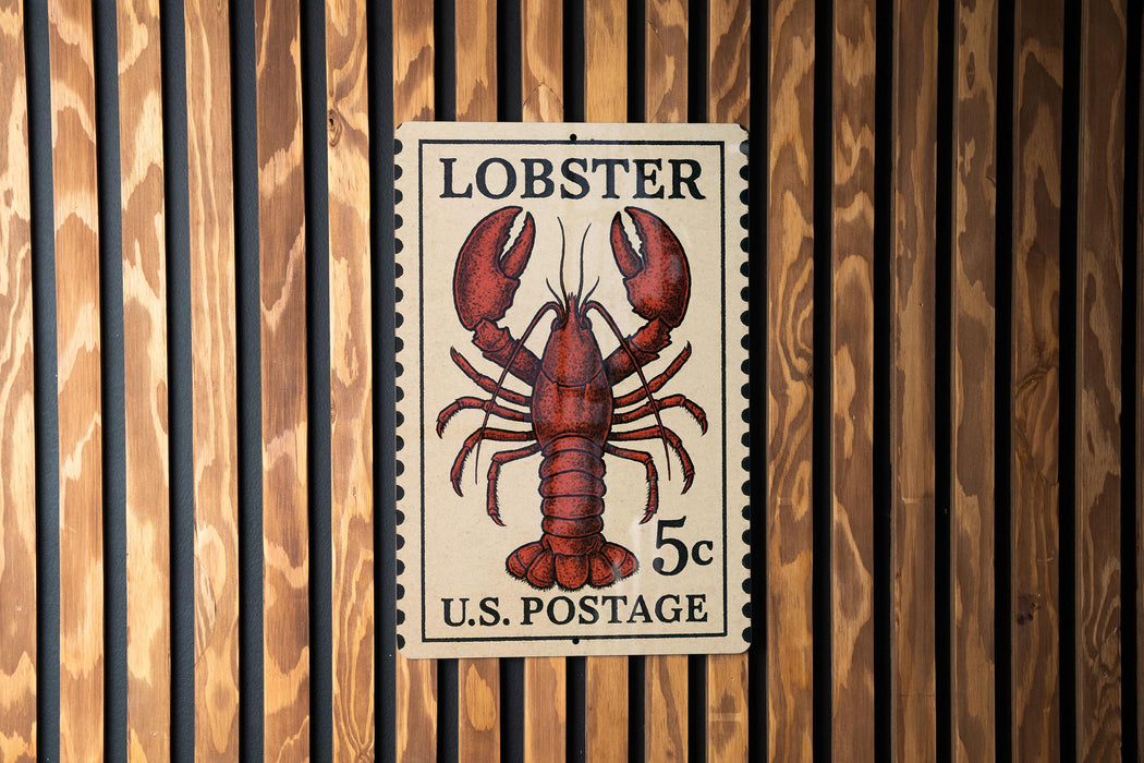 A U.S. postage stamp featuring a lobster illustration.