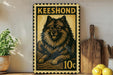 A framed poster of a Pomeranian dog, with the text "Keeshond" and a price of 10 cents, is displayed on a shelf next to a wooden cutting board and some lemons.