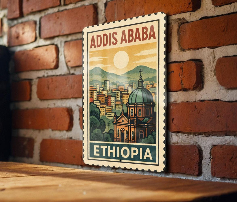 A vintage-style postage stamp depicting the city of Addis Ababa, Ethiopia, with a church and mountains in the background.
