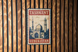 A vintage-style postage stamp from Tashkent, Uzbekistan, featuring a mosque and other architectural elements.