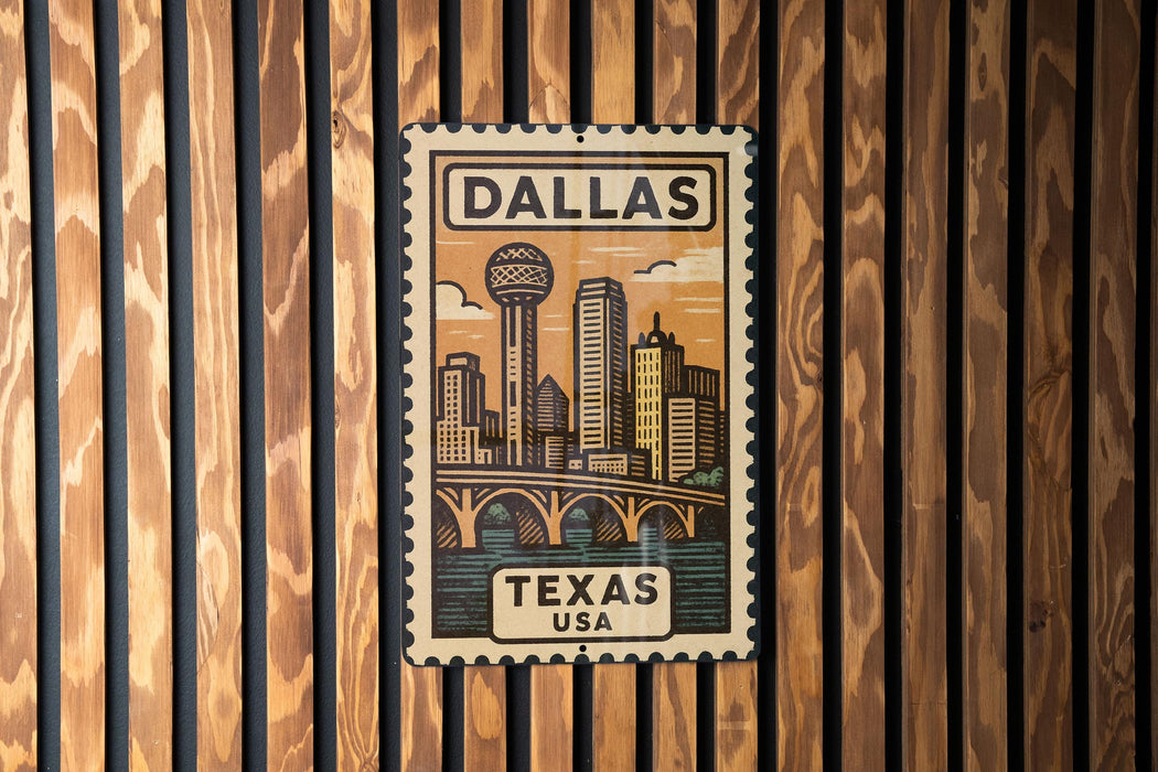 A vintage-style metal stamp depicting the skyline of Dallas, Texas, with the text "DALLAS TEXAS USA" prominently displayed.