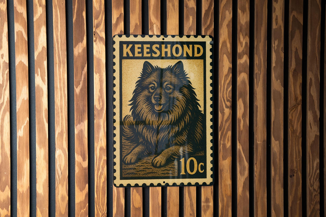 A metal stamp featuring a dog, with the text "Keeshond" and "10c" printed on it, is displayed on a wooden wall.