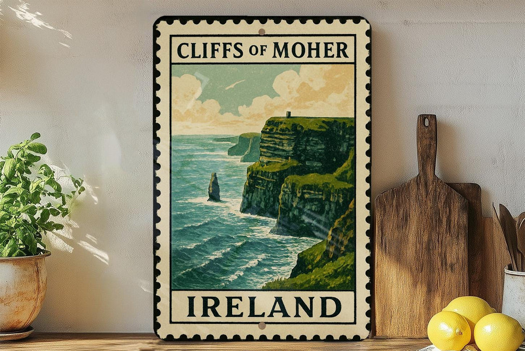 a vintage-style metal sign with the text "CLIFF OF MOHER" and "IRELAND" printed on it, depicting a scenic coastal landscape with cliffs overlooking the ocean.