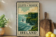a vintage-style metal sign with the text "CLIFF OF MOHER" and "IRELAND" printed on it, depicting a scenic coastal landscape with cliffs overlooking the ocean.