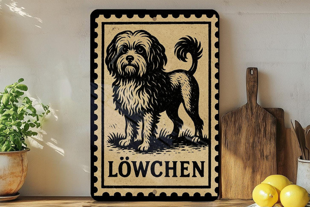 A framed illustration of a dog, specifically a Löwchen, is displayed on a shelf next to a wooden cutting board and some kitchen utensils.