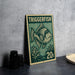 A green and beige postage stamp featuring a fish illustration, placed on a dark surface next to some black objects.