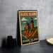 A metal sign with a lighthouse and coastal scene, featuring the text "BLOCK ISLAND RHODE ISLAND USA" on it.