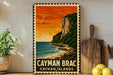 A vintage-style metal sign depicting a tropical beach scene with a cliff overlooking the ocean, surrounded by lush greenery and a warm sunset.