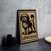 A black and white illustration of a dog, with the word "LÖWCHEN" written below it, is displayed on a wooden frame.