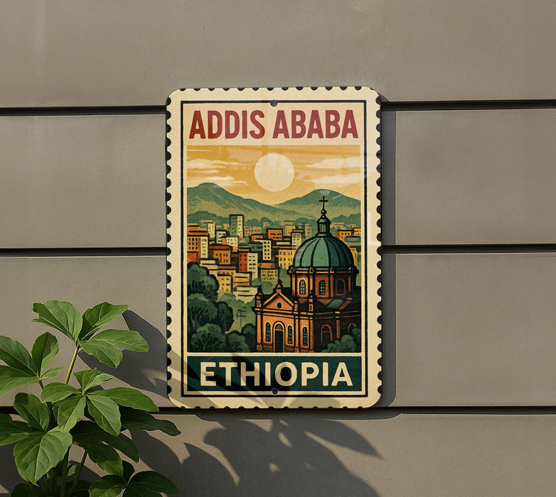 A vintage-style poster or sign for Addis Ababa, Ethiopia, featuring a cityscape with a dome-shaped building and mountains in the background.