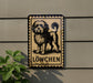 a sign with a dog illustration and the word "Löwchen" below it.