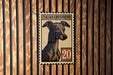 a close-up of a postage stamp with an illustration of an Italian Greyhound dog.
