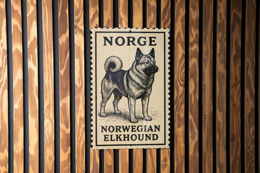 A postage stamp featuring a black and white illustration of a Norwegian elkhound dog.