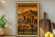 A framed poster of the city of Albuquerque, New Mexico, with a desert landscape and mountains in the background.