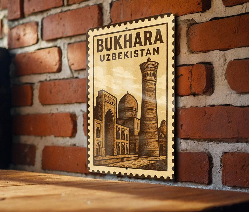 A vintage-style metal sign with the text "BUKHARA UZBEKISTAN" and an illustration of a mosque, mounted on a brick wall.