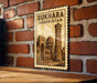 A vintage-style metal sign with the text "BUKHARA UZBEKISTAN" and an illustration of a mosque, mounted on a brick wall.