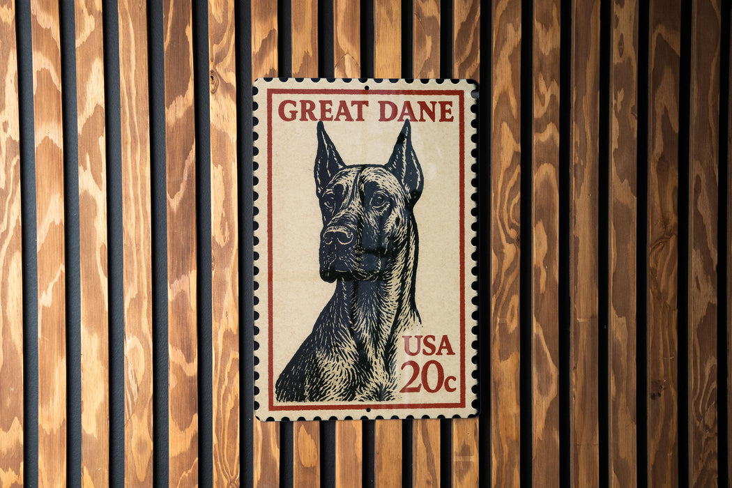A postage stamp featuring a Great Dane dog, with the text "GREAT DANE" and "USA 20c" printed on it.