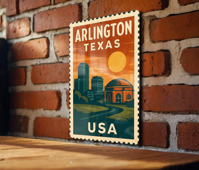 A vintage-style metal sign with the text "ARLINGTON TEXAS USA" displayed on a brick wall.