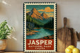 A vintage-style metal sign for Jasper National Park in Canada, featuring a mountain landscape with pine trees and a river.