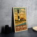A vintage-style metal sign depicting a lighthouse and a coastal scene, with the text "FIRE ISLAND NEW YORK USA" printed on it.