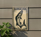 a sign with a fish illustration, mounted on a wall.