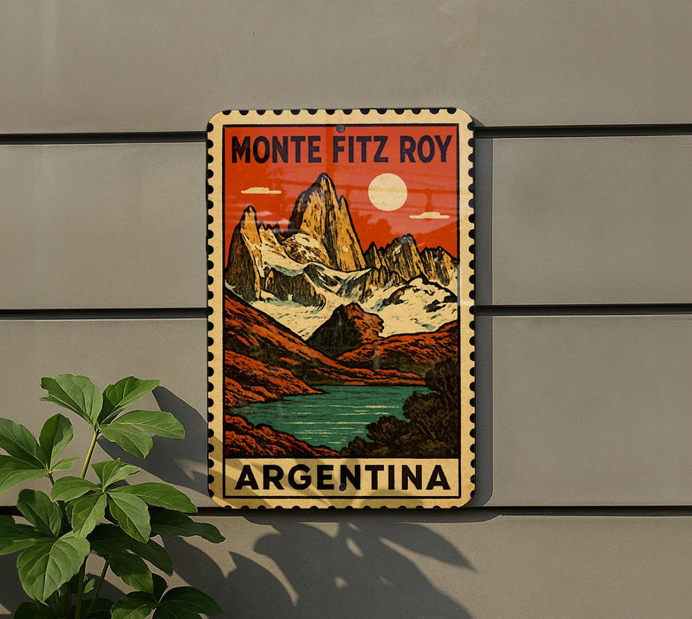 A vintage-style poster of the Monte Fitz Roy mountain range in Argentina, featuring a colorful illustration of the peaks and a serene lake.