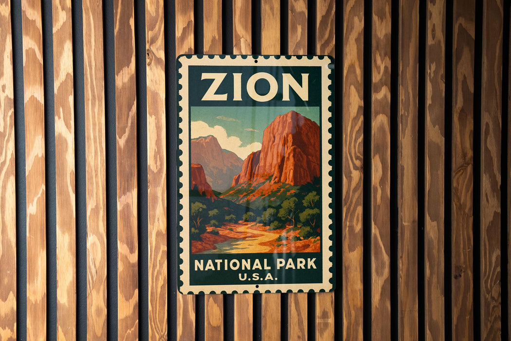 A vintage-style metal sign with the word "ZION" and "NATIONAL PARK U.S.A." printed on it, hanging on a wooden wall.