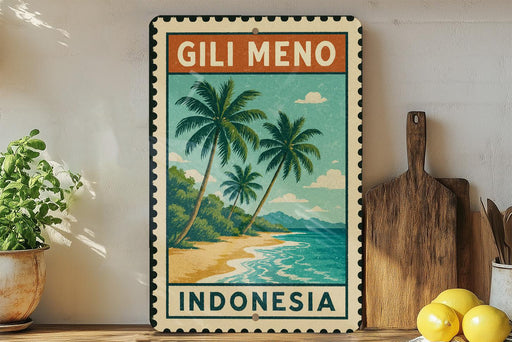 A vintage-style metal sign with a tropical beach scene and palm trees, featuring the text "Gili Meno Indonesia" on it. The sign is displayed on a shelf next to a wooden cutting board and a potted plant.