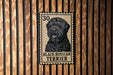 A metal sign featuring a black Russian Terrier dog, with the text "BLACK RUSSIAN TERRIER" printed on it.
