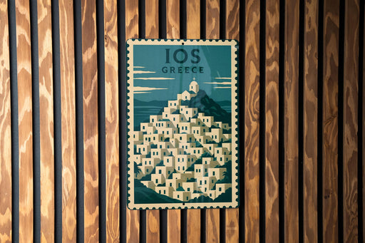 A vintage-style poster of Greek islands is displayed on a wooden wall.